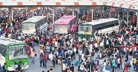 Migrants at Kaushambi bus stand wait to leave for their home towns | Parveen Negi