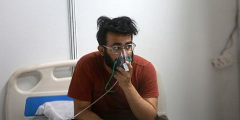 A Covid-19 patient at inside the Covid19 Isolation centre at CWG village in New Delhi. (Photo | Shekhar Yadav, EPS)