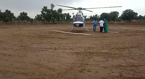The chopper with baby Riya and her mother lands in the village. (Photo | Special arrangement)