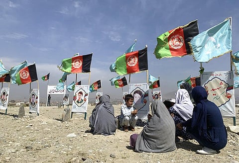 FILE | Families and friends of students who were killed in local conflicts gather at the graves of their relatives, adorned with their pictures, on the outskirts of Kabul. (Photo | AP)