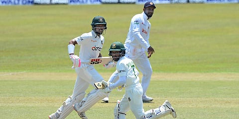 Bangladesh's Mominul Haque (R) and Najmul Hossain run between wickets during the 2nd day of the First test against Sri Lanka in Pallekele. (File photo| AP)
