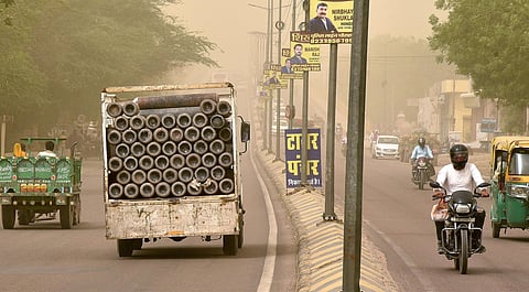 A truck carries oxygen cylinders amidst a dust storm in Bikaner on Friday. (Photo | PTI)