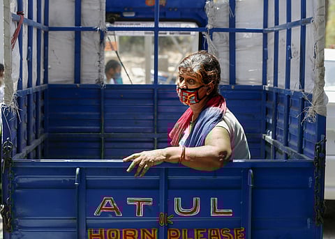 A COVID-19 positive patient waits in a tempo to be admitted in a hospital in Ahmedabad on Friday. (Photo | PTI)