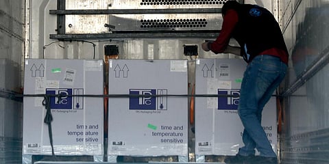 A health worker checks boxes of COVID-19 vaccines inside a truck, that were delivered to Idlib through a border crossing with Turkey, in north-west Syria. (Photo| AP)