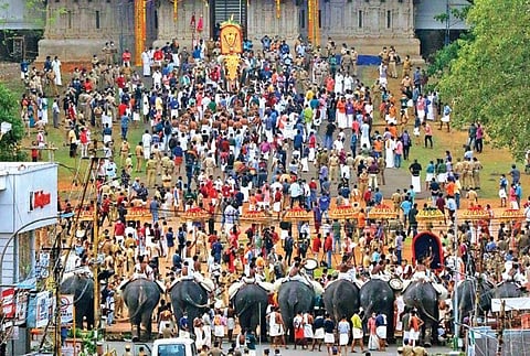 Thiruvambady-Paramekkavu groups facing each other at Thekke Gopura Nada for symbolic Kudamattam as part of Thrissur Pooram on Friday
