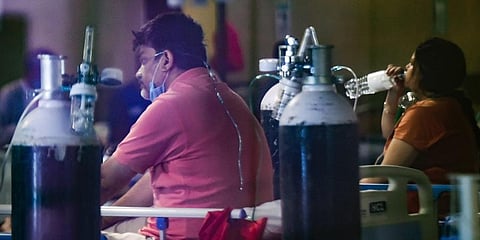 COVID-19 patients receiving treatment at an isolation centre in New Delhi. (Photo | PTI)