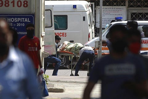A patient is carried on a stretcher at Lok Nayak Jai Prakash Narayan hospital in New Delhi, India, Friday, April 23, 2021. (Photo | AP)