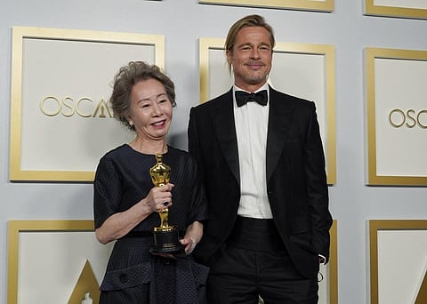 Actor Brad Pitt poses with Yuh-Jung Youn, winner of the award Actress in a Supporting Role for 'Minari,' in the press room at Oscars on April 25, 2021, at Union Station in Los Angeles. (Photo | AFP)