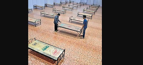 A file photograph of beds being set up at a Covid Care Centre in Bengaluru