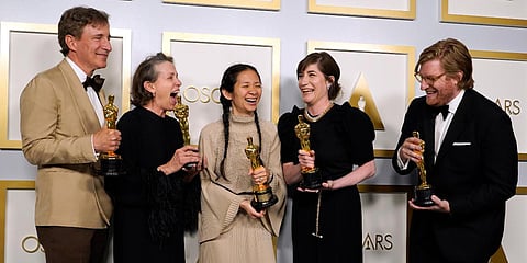 (From left) Producer Peter Spears, actress Frances McDormand, director Chloe Zhao, Mollye Asher and Dan Janvey were declared winners of the award for best picture for 'Nomadland'. (Photo| AP)
