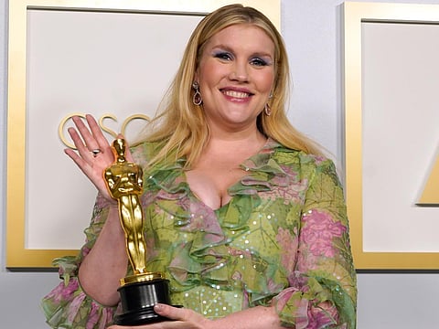 'Best original screenplay' winner Emerald Fennell poses in the press room at the Oscars 2021. (Photo| AP)