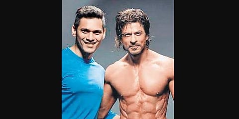 Bollywood actor Shah Rukh Khan with his body double Prashant Walde.