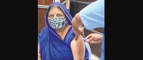 A woman taking vaccination at RGGGH