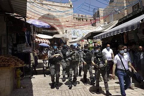 Israeli Border Police patrol the Old City of Jerusalem as worshippers arrive for Friday prayers. (Photo | AP)