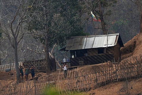 Myanmar soldiers stand at a small army camp along the river bank near the border of Myanmar and Thailand. (Photo | AP)