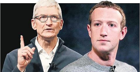 Apple CEO Tim Cook and Mark Zuckerberg, chief executive of Facebook | AP