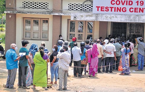People waiting at a Covid testing centre in Vizag on Tuesday | G Satyanarayana