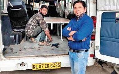 Najeeb in front of his tempo traveller that was recently converted into a Covid care ambulance by attaching first-aid kits and stretchers