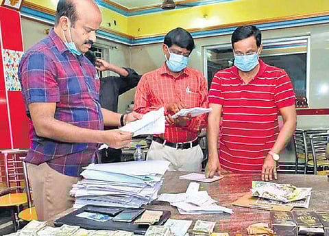Rs 18 lakh cash meant for distribution of cash for votes seized by officials in Vellore on Friday | S Dinesh