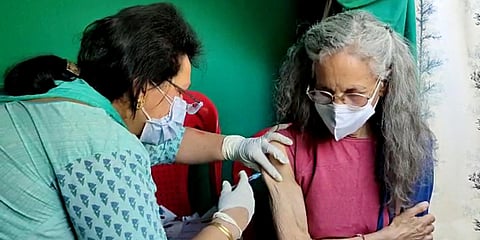Foreign nationals residing at Kullu receive a dose of COVID-19 vaccine. (Photo| PTI)