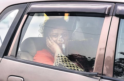 A patient suffering from Covid-19 in a car outside LNJP Hospital in New Delhi on Thursday | Parveen Negi