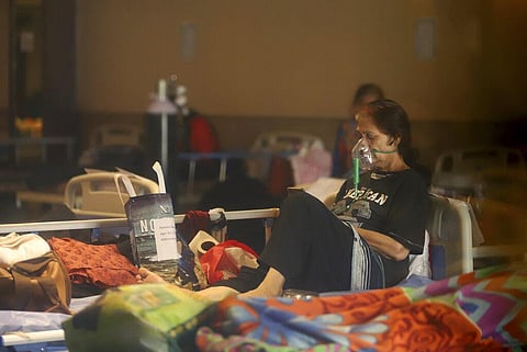 A COVID-19 patient rests on a bed at a makeshift hospital in New Delhi, India, Friday, April 30, 2021. (Photo | AP)
