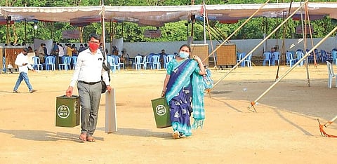 Officials make arrangements for the elections at a polling booth in Khammam