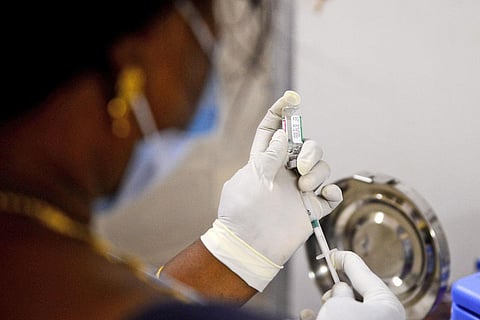 A medical worker prepares to inoculate a person with a dose of COVID vaccine (Photo | Debadatta Mallick, EPS)