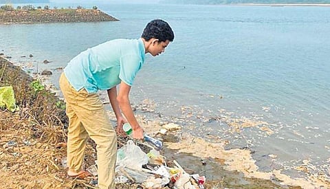 P Uma Maheswara Shastri cleaning up River Godavari; teen activist distributes pamphlets to people to create awareness on river pollution | Express