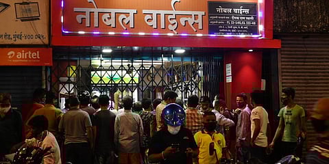 A large crowd at a Mumbai wine shop amid a spike in coronavirus cases. (Photo | ANI)