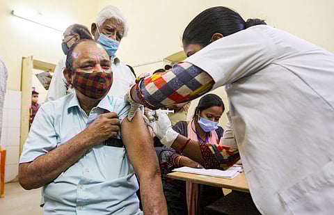 A health worker inoculates COVID-19 vaccine shots to beneficiaries at a vaccination centre in Prayagraj, Monday. (Photo | PTI)