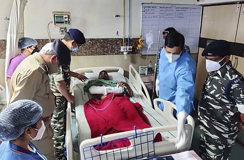 A paramilitary soldier, injured in an encounter with Maoist rebels, being taken on a stretcher for treatment at a hospital. (Photo | PTI)