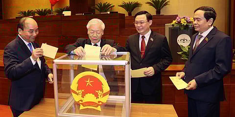 (From left) Vietnamese leaders including President Nguyen Xuan Phuc, Communist General Secretary Nguyen Phu Trong and newly elected PM Pham Minh Chinh (R). (Photo| AP)