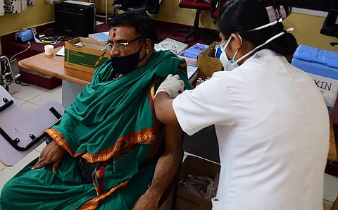 A man gets his vaccination dose against COVID-19 in Bengaluru. (Photo | Sriram BN, EPS)