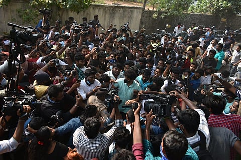Hardcore COVID-immune fans surround actor Vijay, who cycled to his polling booth in Chennai's Neelankarai on Tuesday. (Photo | Aaditheesh Murali, EPS)