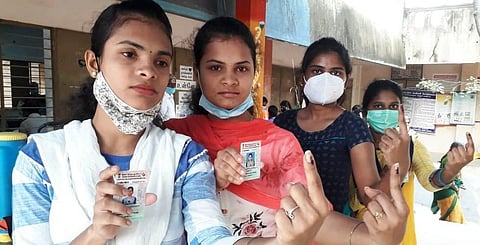 First-time voters show their inked fingers after exercising their franchise in Vellore. (Photo | S Dinesh, EPS)