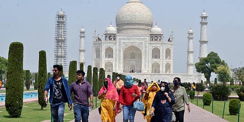 Tourists visiting Taj Mahal in Agra seen without wearing masks. (Photo I ANI)