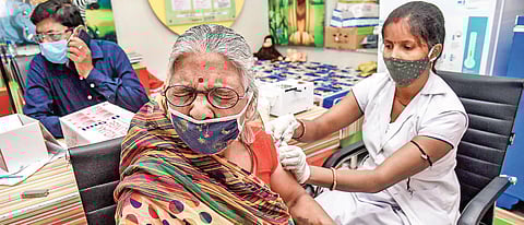 A beneficiary receives a dose of Covid-19 vaccine at a government dispensary in Patna on Wednesday