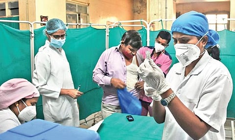 A nurse readies a dose of vaccine at Fever Hospital in Hyderabad | RVK Rao