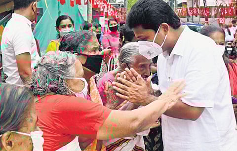 File photo of UDF candidate K Babu seeking votes from traders at Tripunithura town