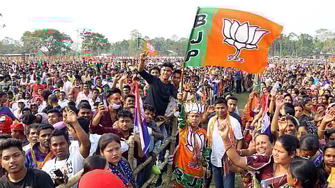 BJP supporters holding party flags