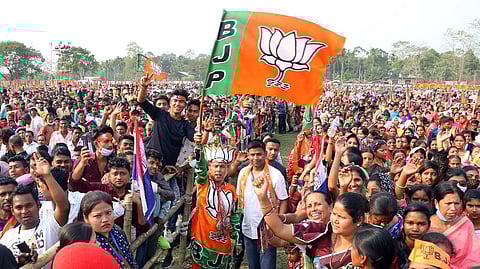 BJP supporters holding party flags