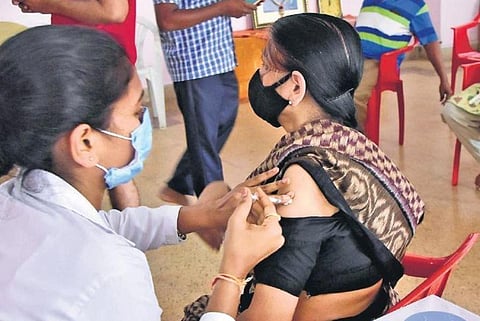 A senior citizen gets vaccinated in Bengaluru on Friday | Express
