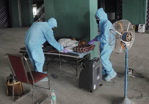 Volunteers provide free oxygen to patients in Noida, Sunday, May 9, 2021. (Photo | PTI)