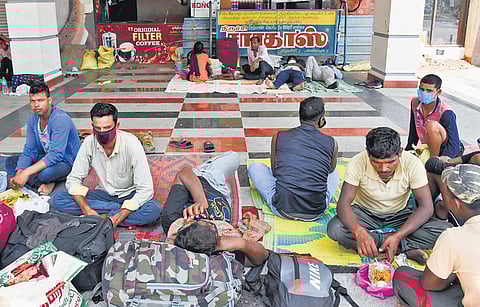 Workers waiting at Tiruchy railway station to board Tuesday’s Howrah Express | MK Ashok Kumar