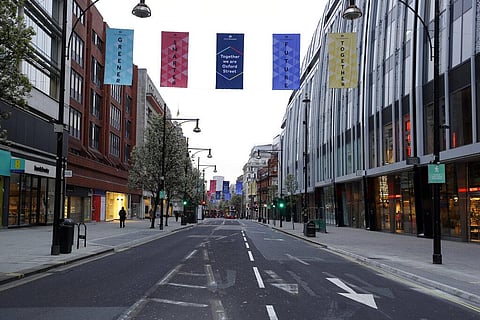 An empty Oxford Street in London before shops open at 7:00am, after coronavirus measures were lifted. (Photo | AP)