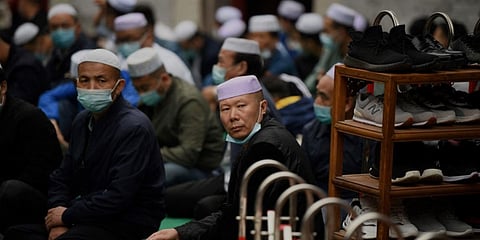 Chinese worshippers participate in Eid al-Fitr prayers, marking the end of the holy month of Ramadan, at the Niujie Mosque in Beijing. (File photo| AFP)