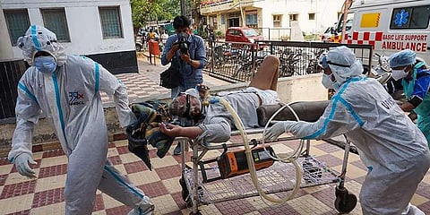 Critical Covid-19 patient being shifted to a hospital. (Photo | PTI)