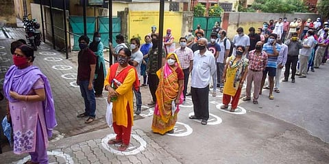 People wait in queue to get their Covid-19 vaccine. (Photo | PTI)