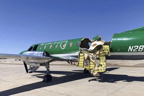 This image from CBS Denver shows a Key Lime Air Metroliner that landed safely at Centennial Airport after a mid-air collision near Denver. (Photo | AP)